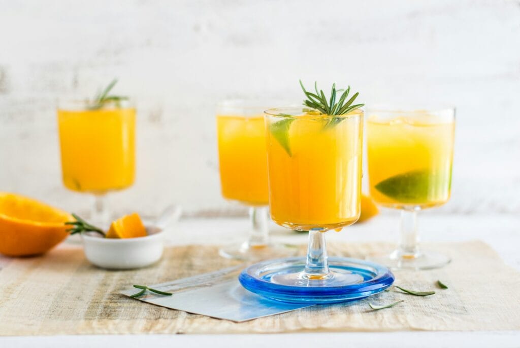 Are Fruit Juices with Pulp Healthier Than Filtered Juices? 3 clear drinking glasses on table, chew as you gulp
